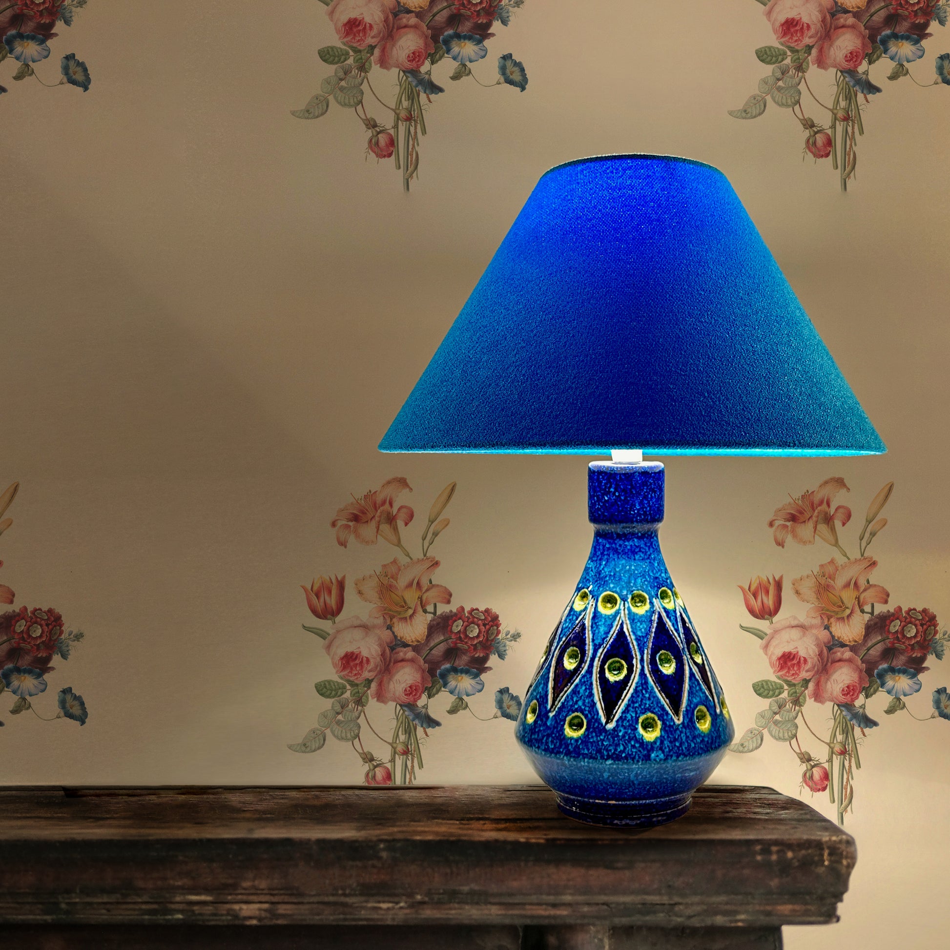 Rimini Blue Gem  Discover the allure of a Rare Mid Century Italian Ceramic Lamp Base, boasting an enchanting Rimini blue and yellow glaze. This vintage gem, bathed in the elegance of a bygone era with maker marked “Italy”.   Complemented by a bespoke handmade empire lampshade. Crafted with recycled lampshade rings and Turquoise fabric made from 40% recycled polyester