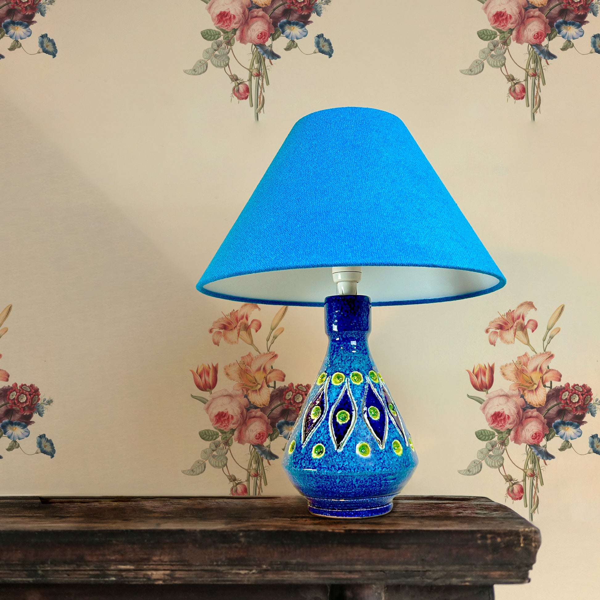 Rimini Blue Gem  Discover the allure of a Rare Mid Century Italian Ceramic Lamp Base, boasting an enchanting Rimini blue and yellow glaze. This vintage gem, bathed in the elegance of a bygone era with maker marked “Italy”.   Complemented by a bespoke handmade empire lampshade. Crafted with recycled lampshade rings and Turquoise fabric made from 40% recycled polyester